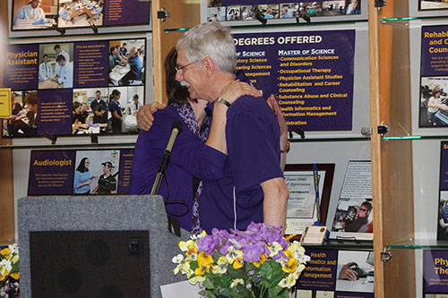 Director of Development Pat Frede and Dean Stephen Thomas embrace after Dr. Thomas learns that the Student Leadership Legacy Fund has been renamed the Dr. Stephen W. Thomas Student Leadership Legacy Fund in honor of his dedication to students and leadership. 